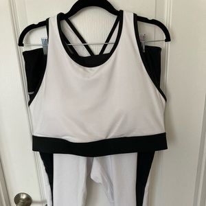 NWOT Fabletics sports bra and 7/8 leggings. White with black trim.